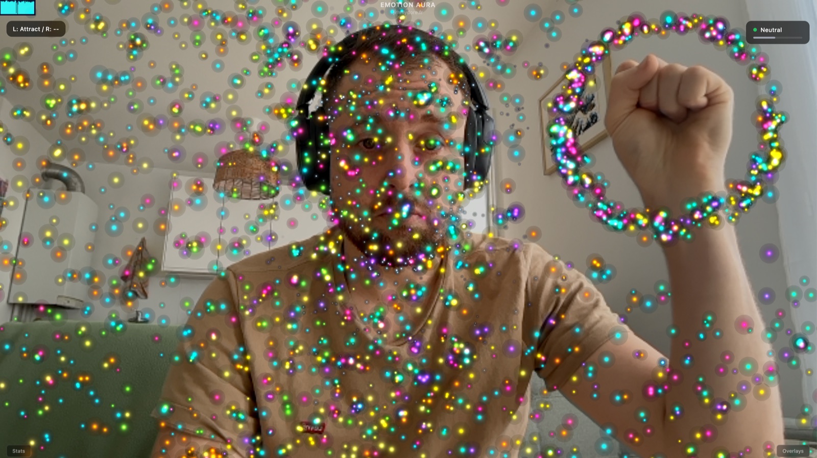 Emotion Aura app showing a face with a colorful GPU particle aura visualizing detected emotion